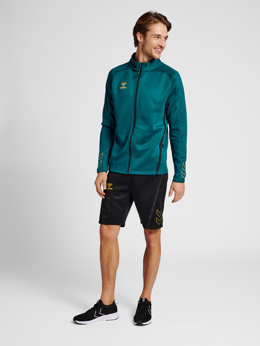 hmlCIMA XK ZIP JACKET, BLUE CORAL, model